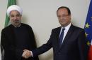 France's President Francois Hollande (R) shakes hands with Iranian President Hassan Rouhani (L) on September 24, 2013 in New York