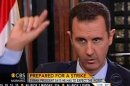 In this frame grab from video taken Sunday, Sept. 8, 2013, and provided by "CBS This Morning," Syrian President Bashar Assad responds to a question from journalist Charlie Rose during an interview in Damascus, Syria. Assad warned in the interview broadcast Monday on CBS there will be retaliation against the U.S. for any military strike launched in response to the alleged chemical weapons attack. Assad said, "You should expect everything." (AP Photo/CBS This Morning)