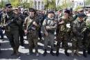 Armed pro-Russia rebels stand guard during celebrations to mark Victory Day in Donetsk, eastern Ukraine