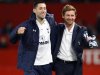 Tottenham Hotspur's manager Villas-Boas celebrates with Dempsey following their English Premier League soccer match against Manchester United at Old Trafford in Manchester