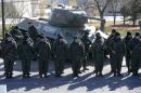 Pro-Russian separatists stand in formation in front of a Soviet World War Two T-34 tank, as they take an oath of loyalty to the separatist Interior ministry in Donetsk