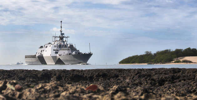 In this photo provided by the U.S. Navy, the USS Freedom littoral combat ship pulls into Pearl Harbor, Hawaii. The USS Freedom, which is stopping in Hawaii on its way to a deployment to Singapore, has advantages bigger U.S. Navy ships lack. (AP Photo/US Navy, Mass Communication Specialist 2nd Class Sean Furey)