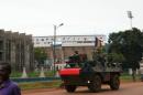 French soldiers patrol aboard a military vehicle on October 23, 2013 in a street in Bangui
