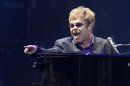 Singer Elton John performs at a charity concert dedicated to the fight against HIV/AIDS in Kiev