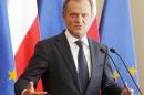 Poland's Prime Minister Donald Tusk gestures as he tells a news conference in Warsaw, Poland on Monday, June 16, 2014, that he sees no reason to fire the Interior Minister after a secret recording was published in the media, suggesting he was making an improper under-the-table deal with the head of the central bank. Tusk said the two official did not break the law, but were discussing ways of helping the Polish state. (AP Photo/Czarek Sokolowski)