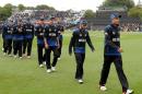 New Zealand's players leave the field after defeating Sri Lanka by 98 runs in the opening match of the Cricket World Cup at Christchurch, New Zealand, Saturday, Feb. 14, 2015. (AP Photo/Ross Setford)