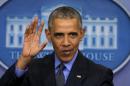 Obama waves as he leaves his end of the year news conference at the White House in Washington