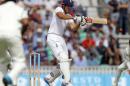 England's captain Alastair Cook hits a boundary during play on the second day of the fifth cricket Test match between England and India at The Oval cricket ground in London on August 16, 2014