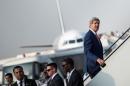 U.S. Secretary of State John Kerry boards his plane at Cairo International Airport