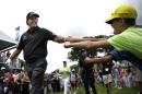 Phil Mickelson greets fans as he walks on the course during the second round of play at The Barclays golf tournament Friday, Aug. 22, 2014, in Paramus, N.J. (AP Photo/Mel Evans)