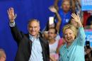 US Democratic presidential candidate Hillary Clinton and running mate Tim Kaine greet supporters at a campaign rally in Miami on July 23, 2016