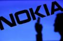 A photo illustration of a man silhouetted against a Nokia logo