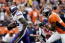 Minnesota Vikings running back Adrian Peterson scores ahead of Denver Broncos free safety Darian Stewart during the second half of an NFL football game Sunday, Oct. 4, 2015, in Denver. (AP Photo/Joe Mahoney)