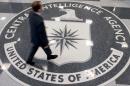 A man crosses the Central Intelligence Agency logo in the lobby of CIA Headquarters in Langley, Virginia, August 14, 2008