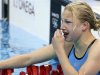 Lithuania's Ruta Meilutyte reacts after taking first place in heat 4 at the women's 100m breaststroke heats during the London 2012 Olympic Games at the Aquatics Centre