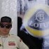 Lotus F1 Formula One driver Raikkonen stands in his team garage during the second practice session of the Japanese F1 Grand Prix at the Suzuka circuit