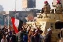 Supporters of Egypt's Sisi cheer at soldiers during a demonstration against the Muslim Brotherhood and other Islamist groups at Tahrir Square in Cairo
