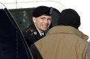 Army Pfc. Bradley Manning, center, steps out of a security vehicle as he is escorted into a courthouse in Fort Meade, Md., Wednesday, Nov. 28, 2012, for a pretrial hearing. Manning is charged with aiding the enemy by causing hundreds of thousands of classified documents to be published on the secret-sharing website WikiLeaks. (AP Photo/Patrick Semansky)