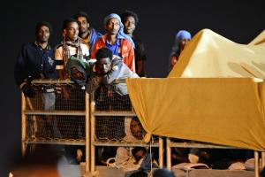 Migrants wait to disembark from the &quot;Phoenix&quot;&nbsp;&hellip;
