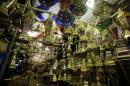 A man walks around stalls selling festival lights and Ramadan lanterns at Sayida Zienab district market during the first day of Ramadan in old Cairo