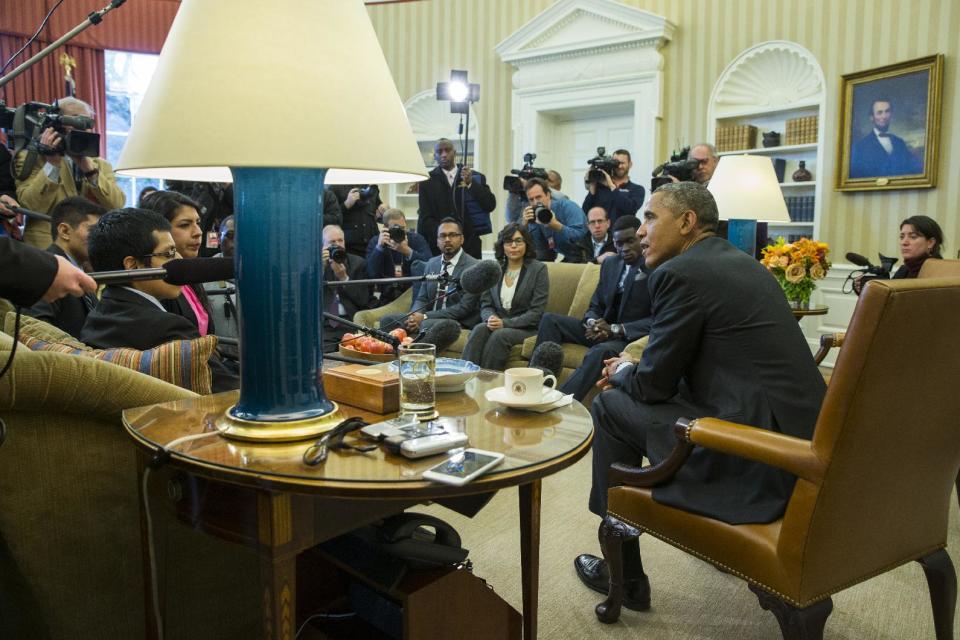 In this Feb. 4, 2015, file photo, President Barack Obama meets with a group of "Dreamers" in the Oval Office of the White House in Washington. A...