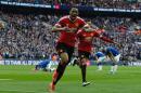 Manchester United striker Anthony Martial (C) celebrates after scoring during the English FA Cup semi-final against Everton on April 23, 2016