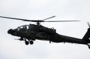 An Apache helicopter hovers on August 1, 2009 in Sparta, Kentucky