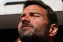 Former trader Jerome Kerviel, closes his eyes during at a press conference in front of his hotel, in Ventimiglia, Italy, near the French border, Sunday, May 18, 2014. The rogue trader facing three years in prison for one of the biggest trading frauds in history is appealing to the French president for mercy. Jerome Kerviel, who almost took down his bank, Societe Generale, with 4.9 billion euros in losses, has been on a months-long pilgrimage back to France after meeting the pope. He stopped his return just short of the border Saturday. Kerviel, convicted in 2010, insists he was the victim of a system that allowed his illegal trades as long as they made money. An appeals court threw out a fine equal to his losses, but upheld his prison sentence. Kerviel is supposed to report to start his sentence by Sunday or be considered a fugitive. (AP Photo/Claude Paris)