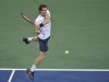 Andy Murray of Britain hits a return to Milos Raonic of Canada during their match at the US Open