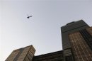 Helicopter flies over the headquarters of state-owned oil giant Pemex in Mexico City