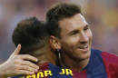Barcelona's Neymar from Brazil celebrates with Lionel Messi from Argentina scoring his side's fifth goal during a Spanish La Liga soccer match between F.C. Barcelona and Granada C.F. at the Camp Nou stadium in Barcelona, Spain, Saturday, Sept. 27, 2014. (AP Photo/Emilio Morenatti)
