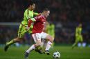 Manchester United's English striker Wayne Rooney (R) vies with CSKA Moscow's defender Georgy Schennikov during a UEFA Chamions league group stage football match at Old Trafford in Manchester, England on November 3, 2015