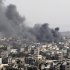 Smoke rises following an Israeli attack in Gaza City, Friday, Nov. 16, 2012. Early Friday, 85 missiles exploded within 45 minutes in Gaza City, sending black pillars of smoke towering above the coastal strip's largest city. The military said it was targeting underground rocket-launching sites. (AP Photo/Adel Hana)