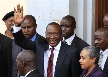 President elect Uhuru Kenyatta greets his supporters in the company of his wife Margaret soon after attending a church service in his rural home town of Gatundu, north of capital Nairobi, March 10, 2013. REUTERS/Noor Khamis