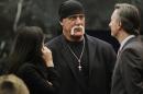 Hulk Hogan talks with his attorneys before the start of his trial Thursday, March 17, 2016, in St. Petersburg, Fla. Hogan, whose given name is Terry Bollea, and his attorneys are suing Gawker Media for $100 million, saying his privacy was violated, and he suffered emotional distress after Gawker posted a sex tape of Hogan and his then-best friend's wife. (Dirk Shadd/The Tampa Bay Times via AP, Pool)