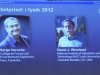 Pictures of the 2012 Nobel Prize for Physics laureates Haroche and Wineland are displayed on a screen during a news conference at the Royal Swedish Academy of Science in Stockholm