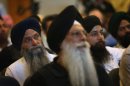 Members of the Milwaukee area Sikh community gather to learn information about the shooting spree of Wade Michael Page