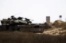 An Israeli army tank takes position along Israel's border with Egypt