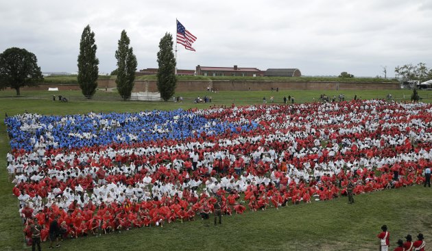 A human U.S. flag is formed by 7,000 Baltimore area school children (REUTERS/Gary Cameron)