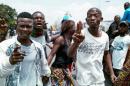 Congolese opposition activists gesture during a march to press President Joseph Kabila to step down in the Democratic Republic of Congo's capital Kinshasa