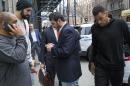 Atlanta Hawks NBA basketball players Pero Antic, left, in hat, and Thabo Sefolosha, right, leave a courthouse in New York, Wednesday, April 8, 2015. The players have been released after their arrest on charges they blocked officers from setting up a crime scene following the stabbing of Indiana Pacers' Chris Copeland. (AP Photo/Craig Ruttle)
