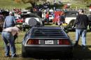 Admirers inspect a 1981 DeLorean DMC-12 at the annual Rockville Maryland Antique and Classic Car Show