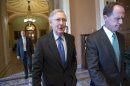 Senate Minority Leader Mitch McConnell, R-Ky., left, and Sen. Pat Toomey, R-Pa., walk to a closed door caucus as lawmakers moved toward resolving their feud over filibusters of White House appointees, at the Capitol in Washington, Tuesday, July 16, 2013. The Senate just voted 71-29 to end a two-year Republican blockade that was preventing Richard Cordray from winning confirmation as director of the Consumer Financial Protection Bureau. (AP Photo/J. Scott Applewhite)