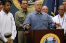 New Orleans Mayor Mitch Landrieu talks about Tropical Storm Isaac as Louisiana Governor Bobby Jindal looks on during a news conference in New Orleans