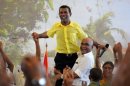 Former Maldives president Mohamed Nasheed greets supporters in Male in February 2012