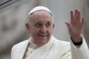 Pope Francis waves as he leaves at the end of his weekly general audience in St. Peter's Square at the Vatican, Wednesday, Feb. 5, 2014. A U.N. human rights committee denounced the Vatican on Wednesday for 