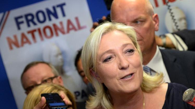 French far-right Front National (FN) party president Marine Le Pen reacts at the party&#39;s headquarters in Nanterre, outside Paris, on May 25, 2014
