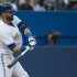 Toronto Blue Jays right fielder Jose Bautista hits a double against the Atlanta Braves during third inning interleague baseball action in Toronto on Monday, May 27, 2013. (AP Photo/The Canadian Press, Nathan Denette)