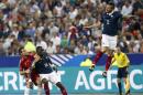 France's Mathieu Debuchy, right, jumps for the ball, as France's Moussa Sissoko, center, and Spain's David Azpilicueta look on during their international friendly soccer match at the Stade de France in Saint Denis, outside Paris, Thursday, Sept. 4, 2014. (AP Photo/Christophe Ena)