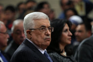 Palestinian President Mahmoud Abbas, attends Christmas Midnight Mass at Saint Catherine's Church in the West Bank town of Bethlehem, early Tuesday, Dec. 25, 2012. (AP Photo/Abed Al Hashlamoun, Pool)